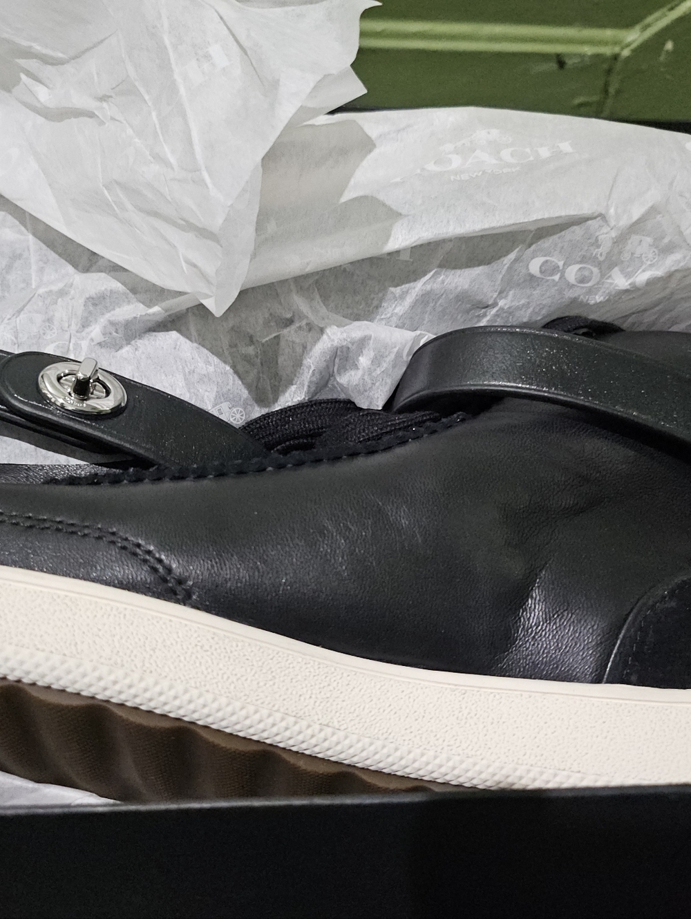 Coach Men’s Black Leather Strap Sneaker with White Sole